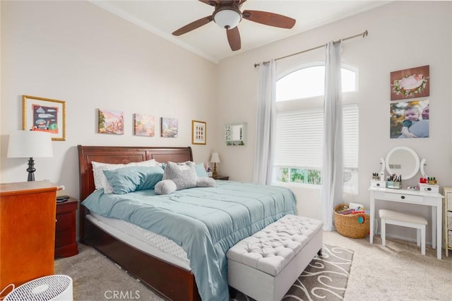 bedroom featuring a ceiling fan, carpet floors, and crown molding