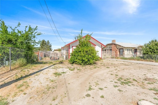 270 San Jacinto St, San Jacinto, CA 92544 - view of yard with fence and a gate