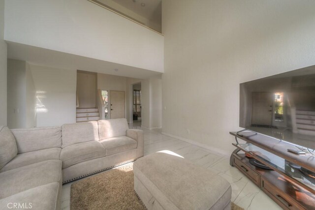 10917 Breezy Meadow Dr, Moreno Valley, CA 92557 - living room with baseboards and a towering ceiling