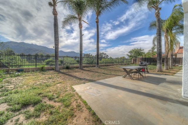 10917 Breezy Meadow Dr, Moreno Valley, CA 92557 - view of yard featuring a fenced backyard, a mountain view, and a patio