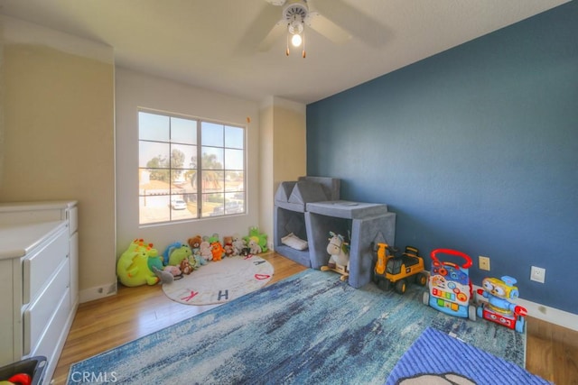 10917 Breezy Meadow Dr, Moreno Valley, CA 92557 - rec room with baseboards, wood finished floors, and ceiling fan