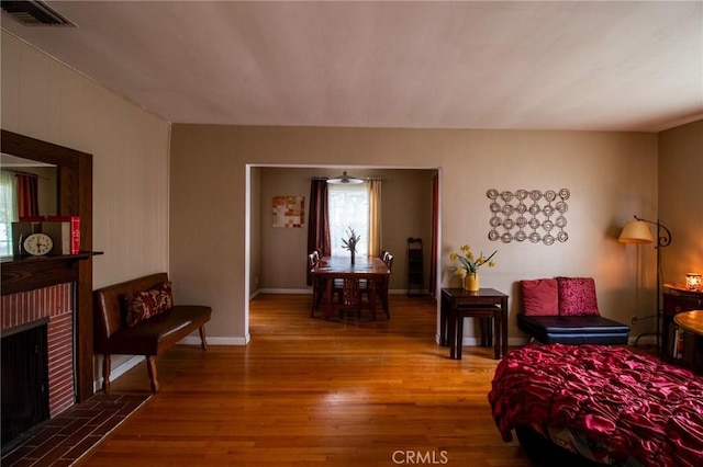 2484 Hanning Ave, Altadena, CA 91001 - living area with wood finished floors, a fireplace, and baseboards