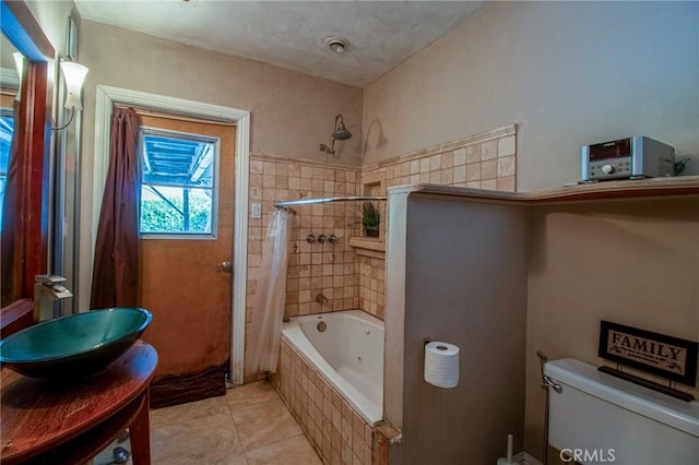 2484 Hanning Ave, Altadena, CA 91001 - full bathroom featuring tiled shower / bath combo, toilet, vanity, and tile patterned flooring