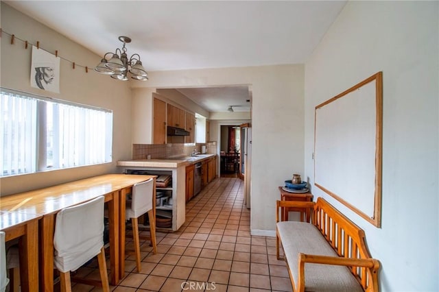 2484 Hanning Ave, Altadena, CA 91001 - kitchen featuring a chandelier, light countertops, dishwasher, light tile patterned floors, and backsplash