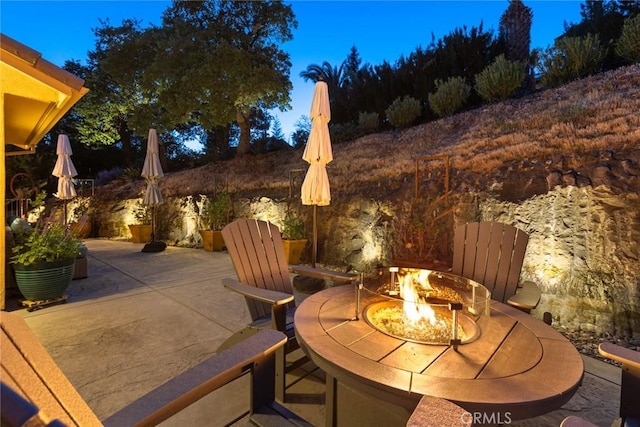 view of patio / terrace featuring an outdoor fire pit
