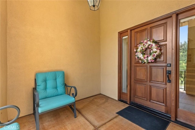 entrance to property featuring stucco siding