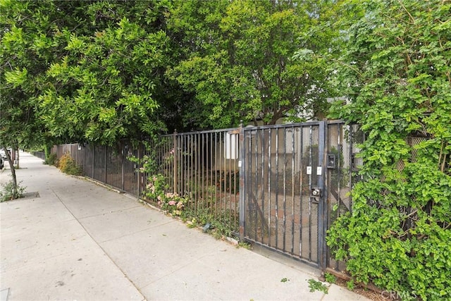 view of gate featuring fence