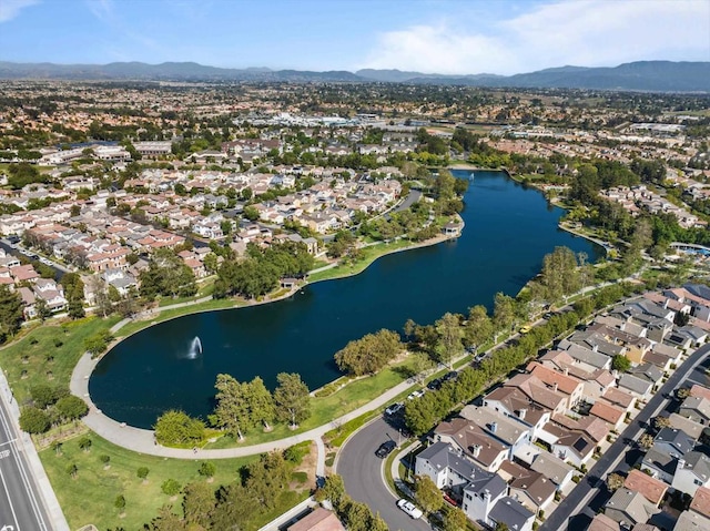 aerial view with a water and mountain view and a residential view