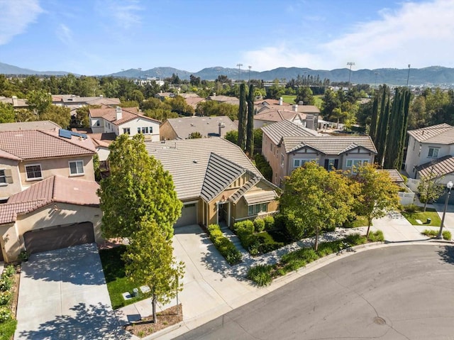 drone / aerial view with a residential view and a mountain view