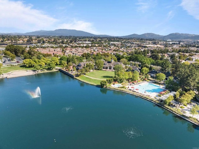 aerial view featuring a residential view and a water and mountain view