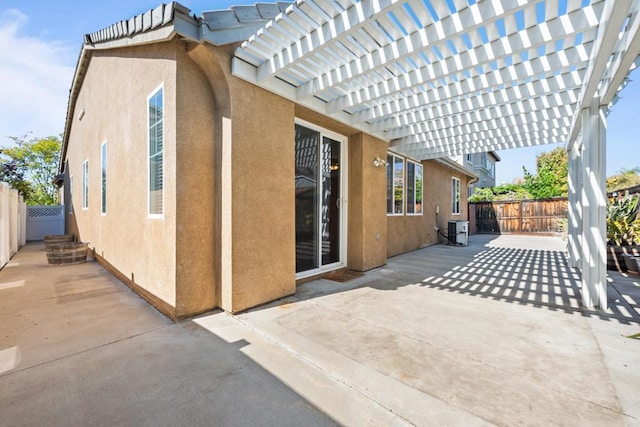 view of patio / terrace with a pergola, a fenced backyard, and central AC