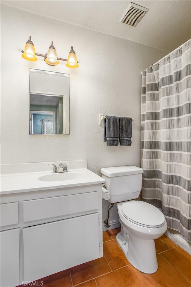 full bath featuring visible vents, tile patterned flooring, toilet, and vanity