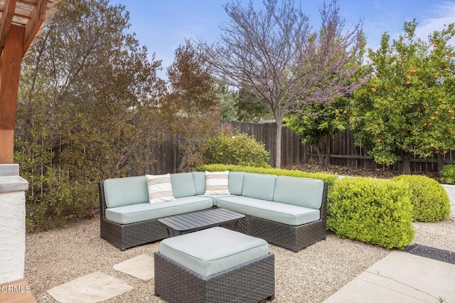 view of patio featuring fence and an outdoor living space