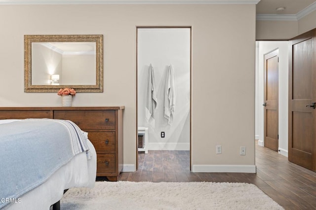 bedroom with baseboards, ornamental molding, and wood-type flooring