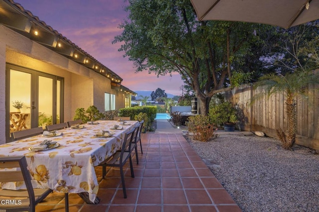 view of patio with outdoor dry bar and a fenced backyard