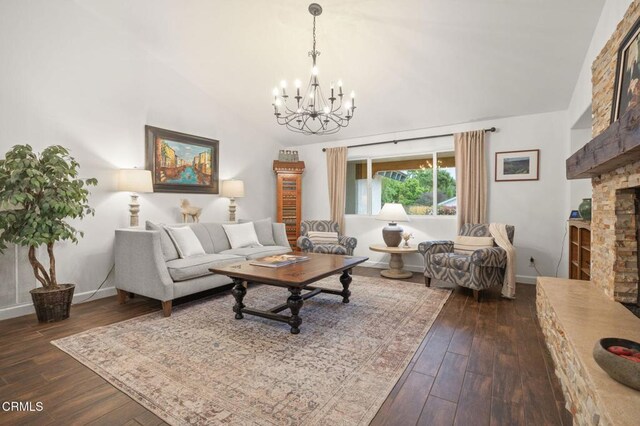 1109 Daly Rd, Ojai, CA 93023 - living room with a chandelier, a fireplace, dark wood-style floors, baseboards, and high vaulted ceiling