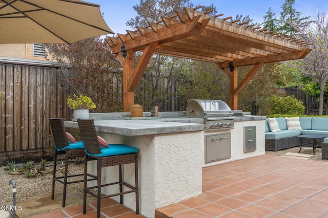 1109 Daly Rd, Ojai, CA 93023 - view of patio / terrace with fence, area for grilling, exterior kitchen, and a pergola