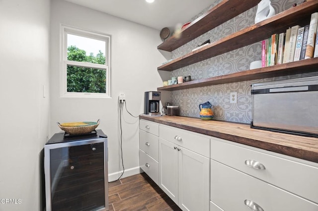 1109 Daly Rd, Ojai, CA 93023 - bar featuring wine cooler, dark wood-type flooring, backsplash, baseboards, and recessed lighting