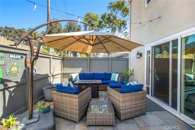 view of patio with outdoor lounge area and a fenced backyard
