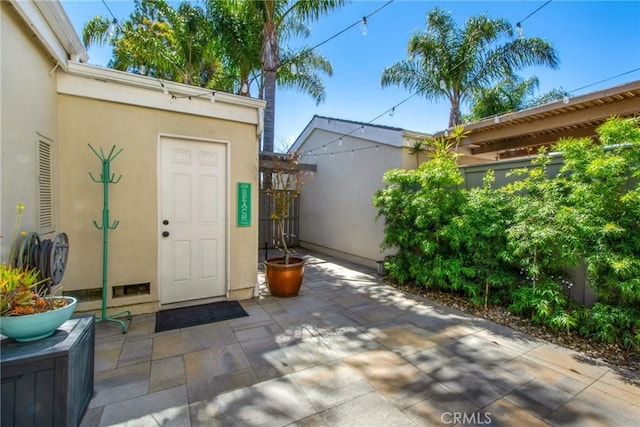 view of patio / terrace featuring fence