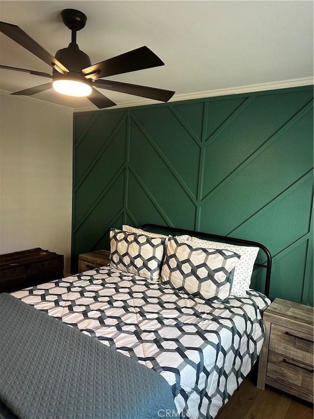 bedroom with a ceiling fan and wood finished floors