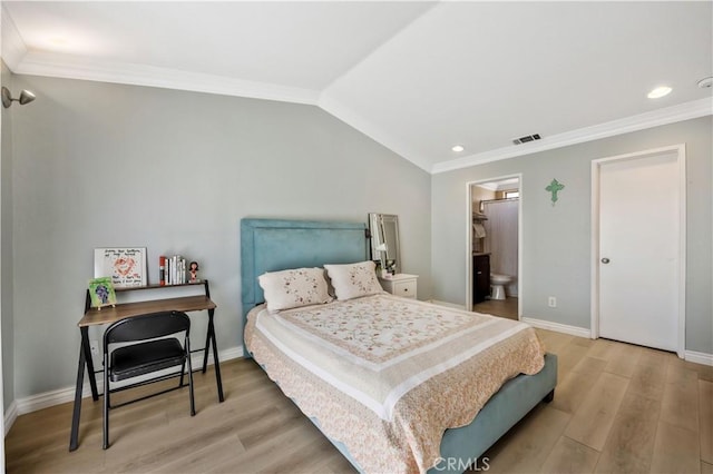 bedroom with light wood finished floors, vaulted ceiling, visible vents, ornamental molding, and baseboards