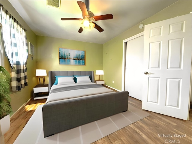 1120 S Yorktown St, Ridgecrest, CA 93555 - bedroom with wood finished floors, a closet, and ceiling fan