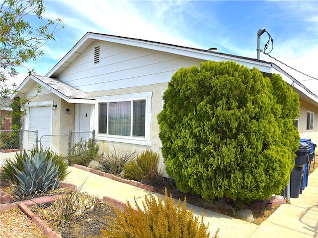 1120 S Yorktown St, Ridgecrest, CA 93555 - view of front of house featuring stucco siding and a shingled roof