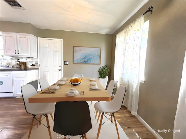 1120 S Yorktown St, Ridgecrest, CA 93555 - dining space featuring dark wood-style flooring and baseboards