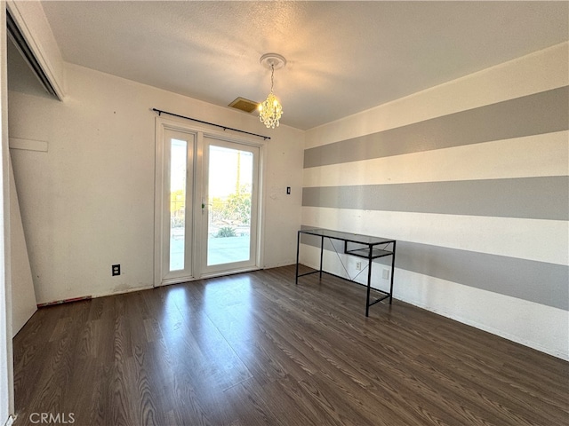 1120 S Yorktown St, Ridgecrest, CA 93555 - spare room featuring dark wood-type flooring and a chandelier