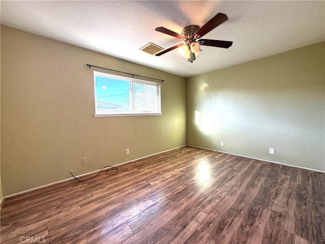 1120 S Yorktown St, Ridgecrest, CA 93555 - empty room with wood finished floors and a ceiling fan