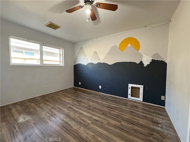 1120 S Yorktown St, Ridgecrest, CA 93555 - empty room featuring ceiling fan and wood finished floors