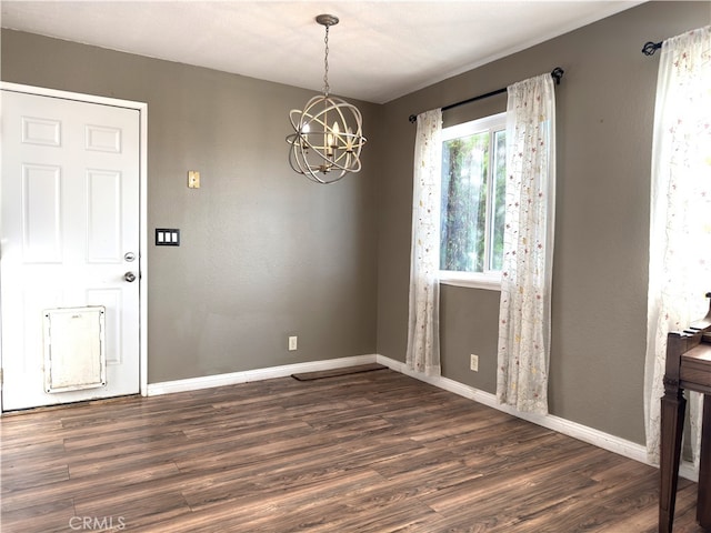 1120 S Yorktown St, Ridgecrest, CA 93555 - unfurnished dining area featuring a chandelier and dark wood finished floors