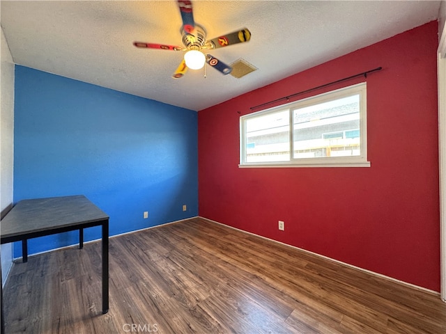 1120 S Yorktown St, Ridgecrest, CA 93555 - spare room with a ceiling fan, wood finished floors, and a textured ceiling