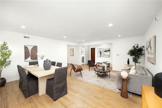 dining room with recessed lighting, visible vents, and light wood-style flooring