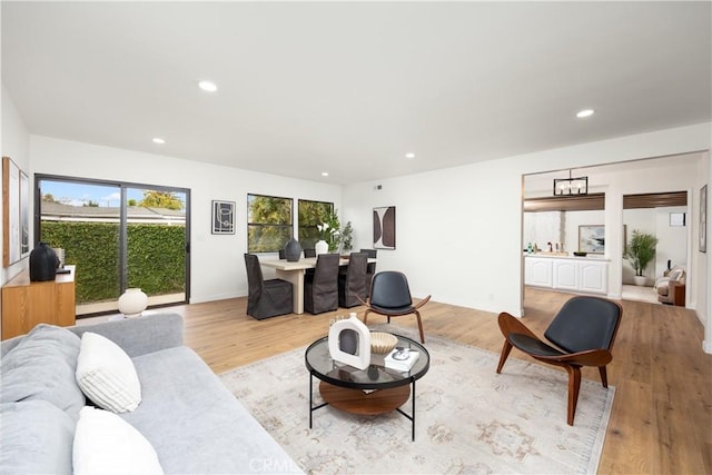 living area featuring recessed lighting and light wood-style floors
