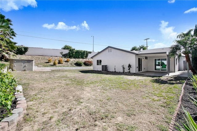 view of yard with a patio area and central AC