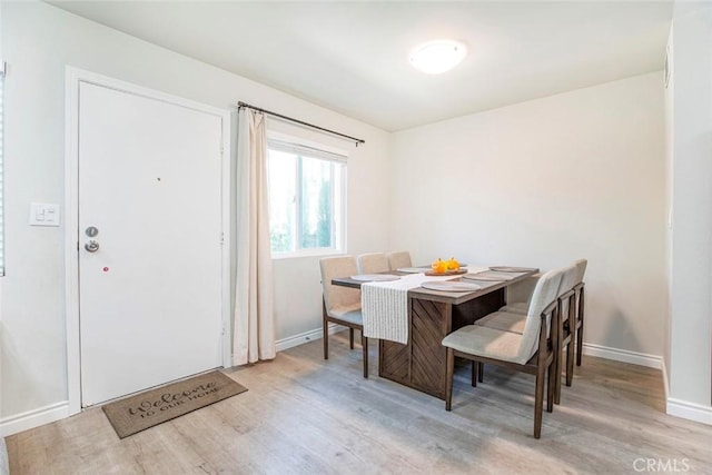 809 E Acacia Ave Unit H, Glendale, CA 91205 - dining space with baseboards and wood finished floors