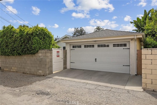 detached garage with fence