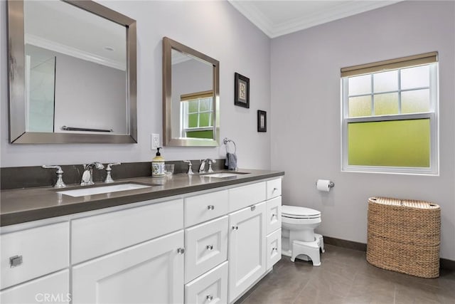 full bath with crown molding, toilet, baseboards, and double vanity
