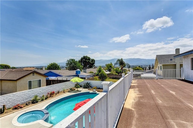 917 Brandywine Ln, Corona, CA 92880 - view of pool with a fenced backyard, a mountain view, and a pool with connected hot tub