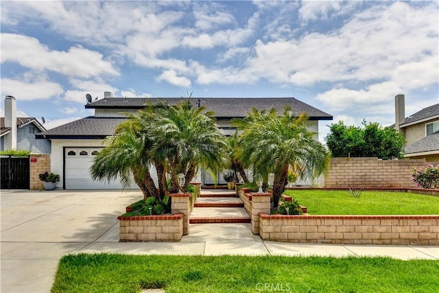 917 Brandywine Ln, Corona, CA 92880 - view of front facade with driveway, a garage, a shingled roof, and stucco siding