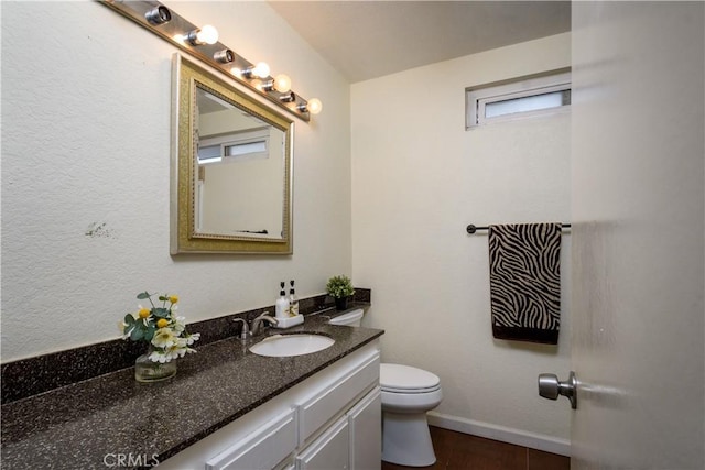 917 Brandywine Ln, Corona, CA 92880 - bathroom featuring toilet, vanity, baseboards, and wood finished floors