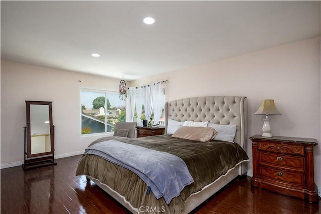bedroom featuring wood finished floors, recessed lighting, and baseboards