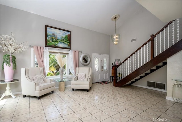 917 Brandywine Ln, Corona, CA 92880 - entrance foyer featuring high vaulted ceiling, a chandelier, stairs, and baseboards