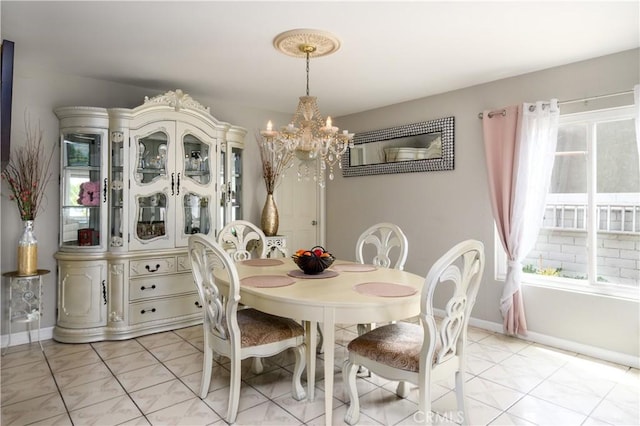 917 Brandywine Ln, Corona, CA 92880 - dining space featuring a chandelier and baseboards