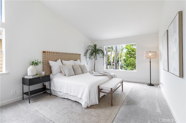 2720 E Walnut Ave Unit 10, Orange, CA 92867 - carpeted bedroom with vaulted ceiling and baseboards