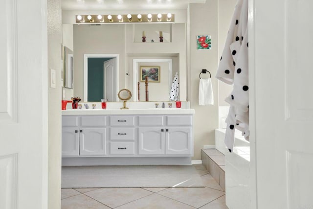 14082 Montfort Ct, San Diego, CA 92128 - full bathroom with tile patterned floors, double vanity, and a bath