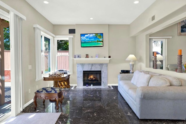 14082 Montfort Ct, San Diego, CA 92128 - living room with marble tiled floors, a premium fireplace, plenty of natural light, baseboards, and recessed lighting