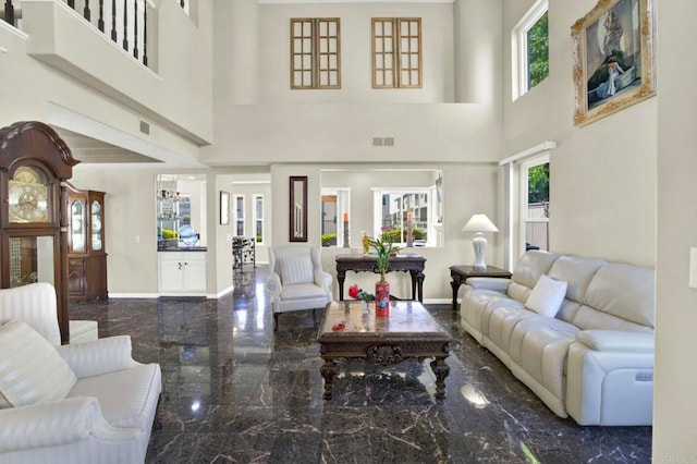 14082 Montfort Ct, San Diego, CA 92128 - living area featuring a towering ceiling, marble tiled flooring, and baseboards